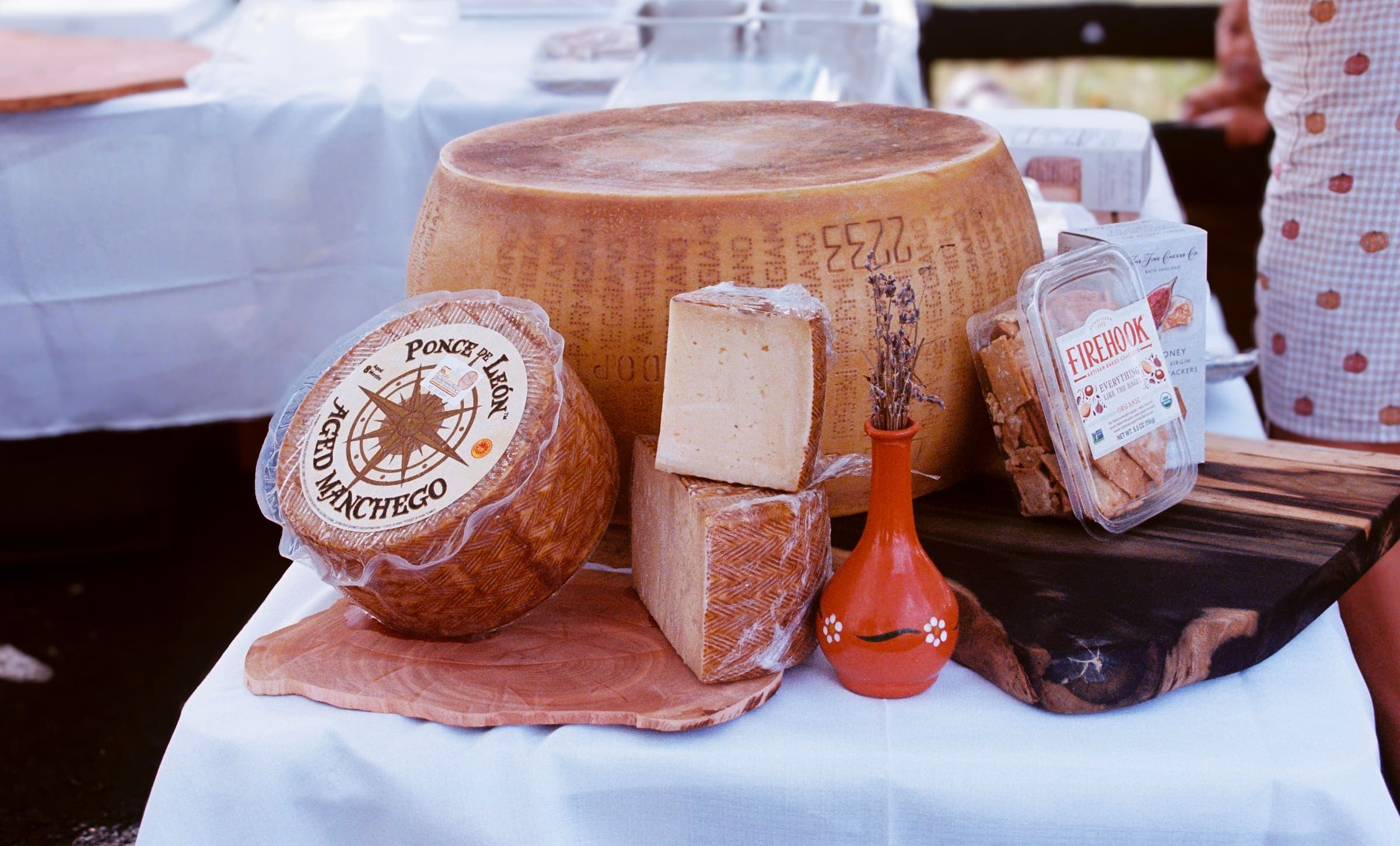 A tableau of specialty cheeses sourced from small producers